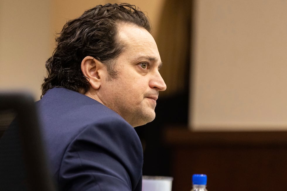 FILE - Charlie Adelson looks at jurors as his defense attorney presents closing arguments,...