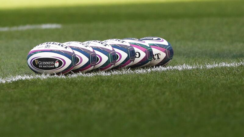 Rugby balls are lined up on the pitch prior to the start of the rugby union international...