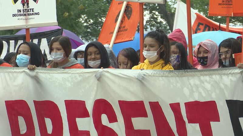 Marching from Steamboat Park to north to the capitol, protesters called for proposed education...