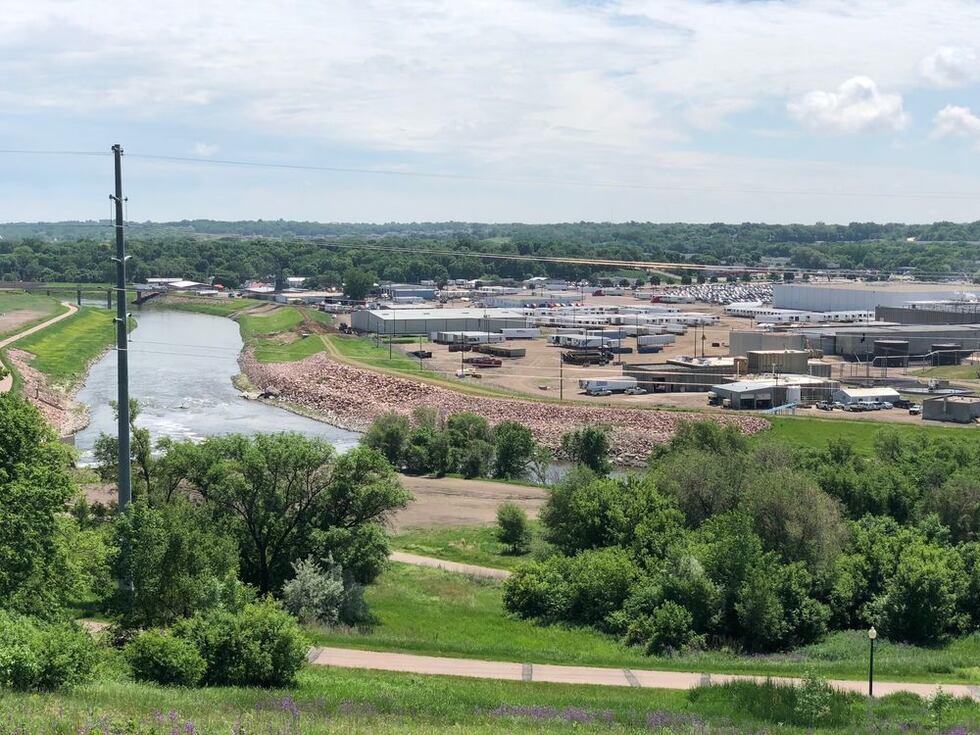 The Big Sioux River east of downtown Sioux Falls, shown here, is proposed to flood...