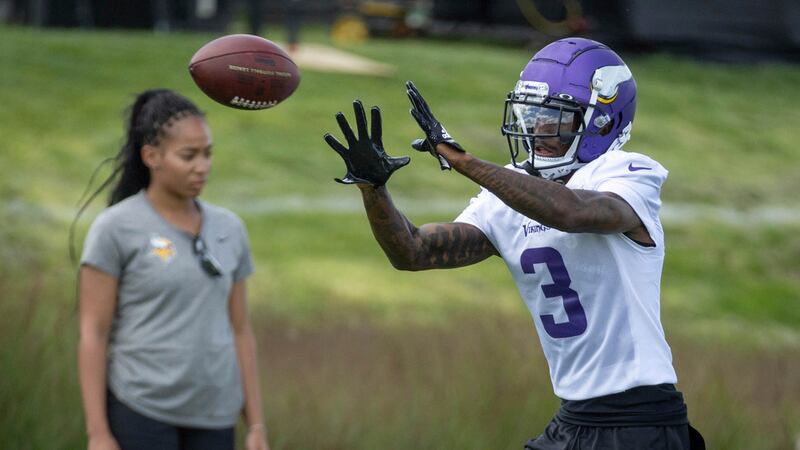 Minnesota Vikings wide receiver Jordan Addison catches a pass in drills during an NFL football...