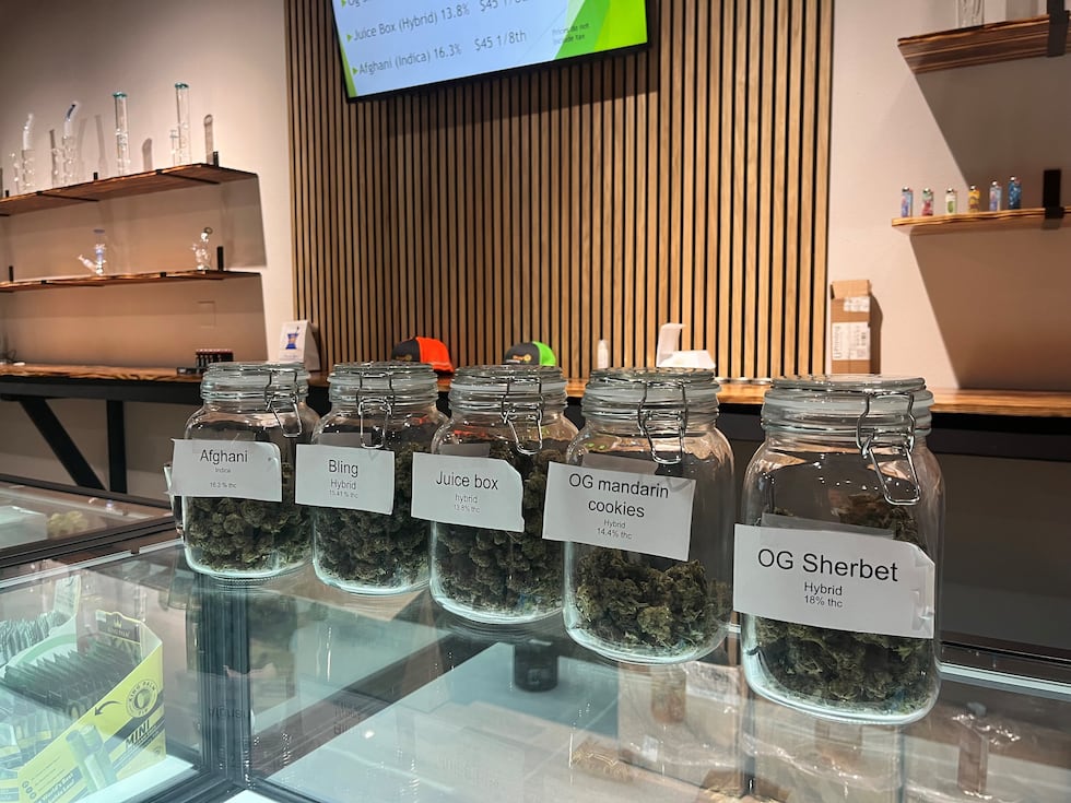 Glass jars contain different types of cannabis products available for purchase at the Flower...