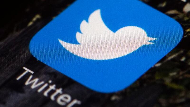 FILE - This April 26, 2017, file photo shows the Twitter app icon on a mobile phone in...