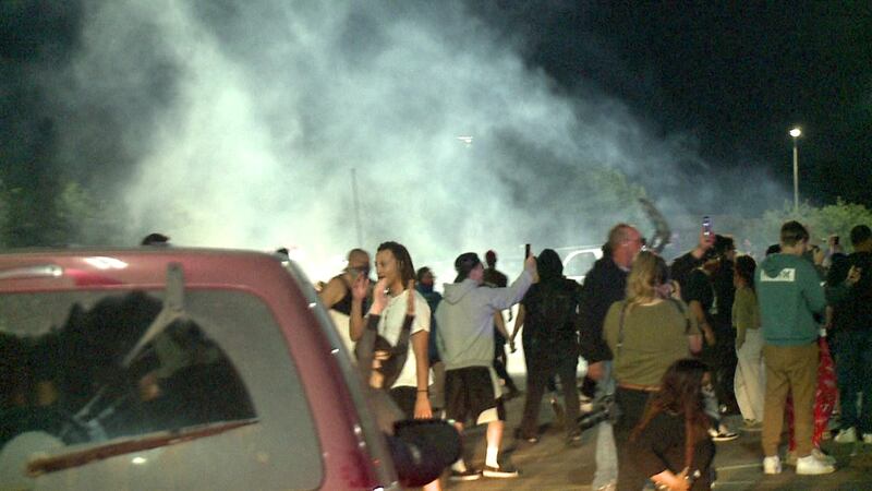 A haze of what appears to be tear gas hovers over protests that broke out outside the Empire...